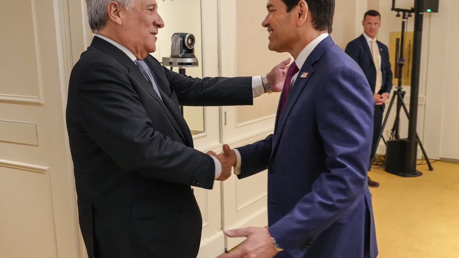 Antonio Tajani and Marco Rubio shake hands and smile at a diplomatic meeting in New York.