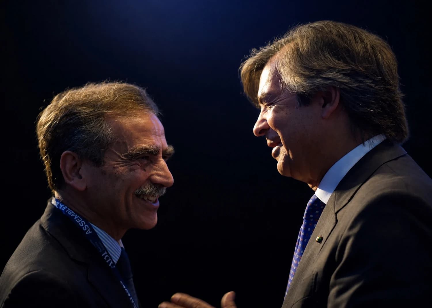 Luigi Lovaglio, CEO of MPS, and Carlo Messina, CEO of Intesa Sanpaolo, speak together.